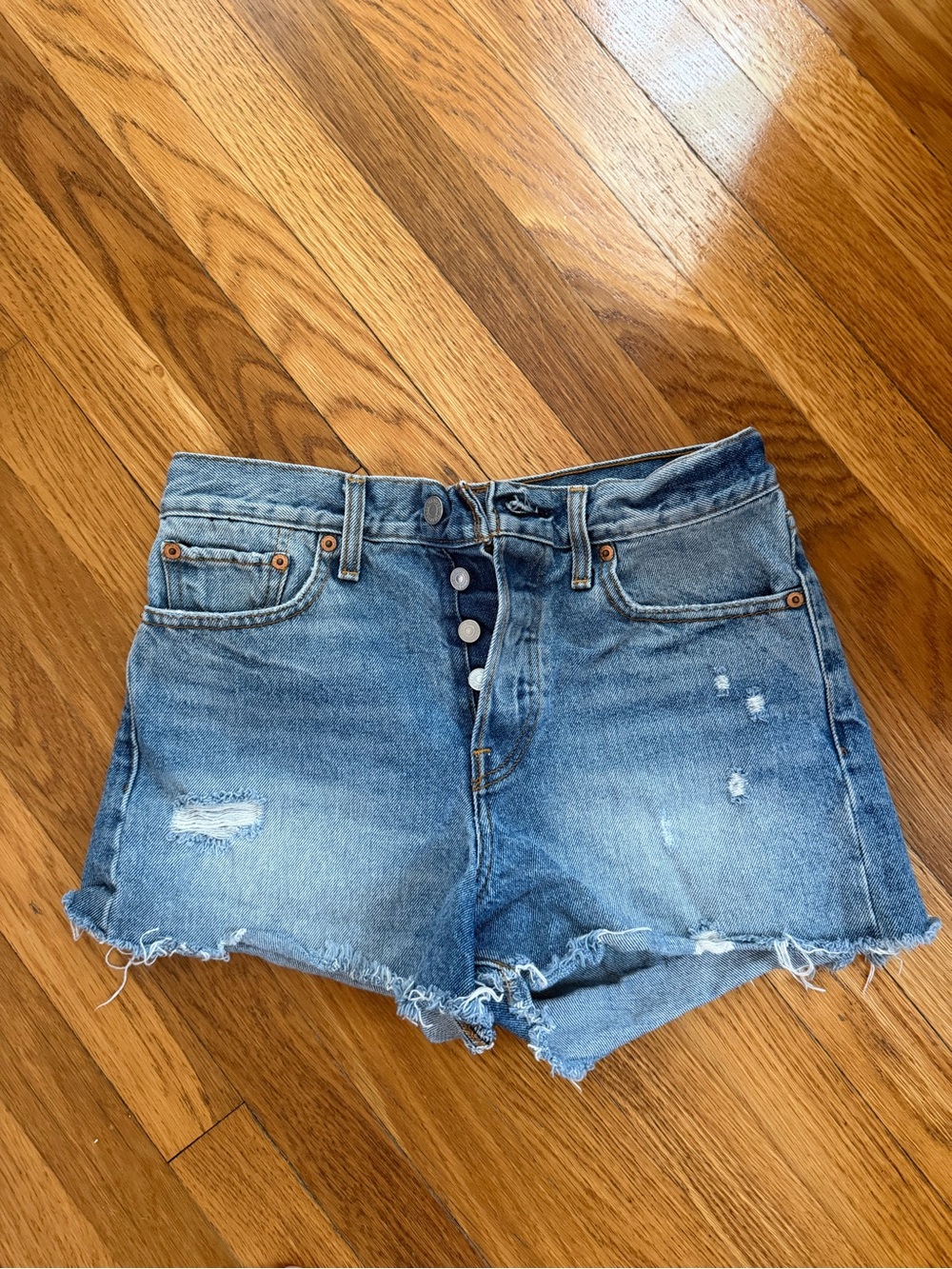 Levi’s High-Rise Distressed Denim Shorts in Light Blue